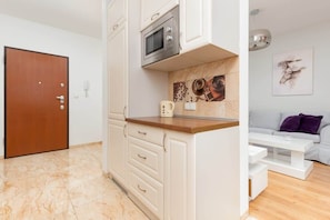 The fully equipped kitchenette includes everything you need for a home-cooked meal.