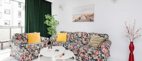 Living room with a comfortable sofa and TV.