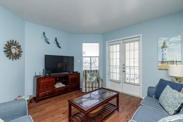 Cozy and spacious living room showcasing coastal decor & plush seating options