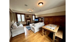 Lounge with dining table and Courtyard Views and rear Garden Views 