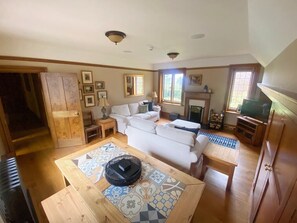 Lounge with dining table and Courtyard Views and rear Garden Views 