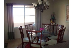 Dining area with view of the beach, sunrise, sunset