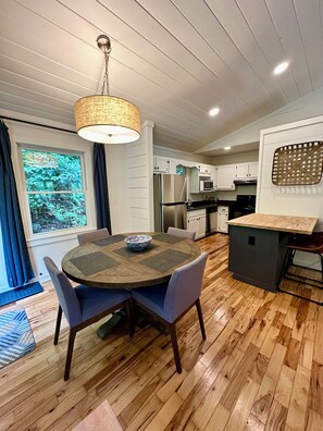 Fully stocked kitchen w/coffee maker, Keurig, tea kettle, and bar seating.