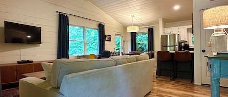Entry from the deck, living and dining rooms.