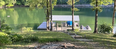 Minimal steps to the lake, fenced in yard, 1 covered boat slip and swim platform