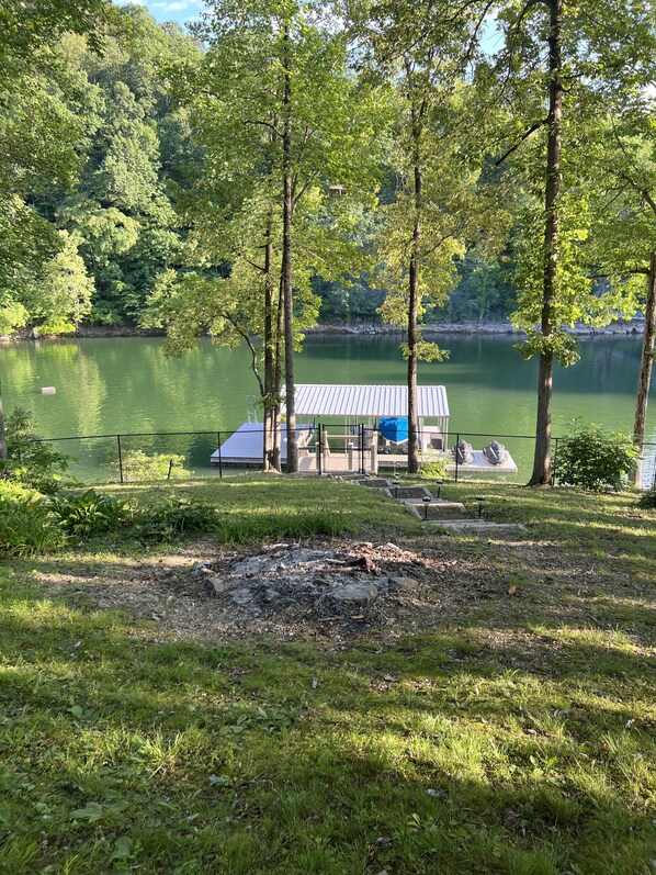 Minimal steps to the lake, fenced in yard, 1 covered boat slip and swim platform