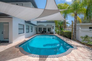 Pool remodel was just completed! New tile, New finish, added sails!