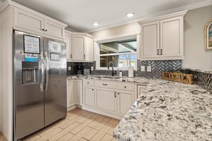 The dishwasher is located right next to the sink.