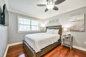 Relaxing bedroom with Smart TV and large closet.