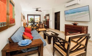 Walk into a cozy and airy living area to find the perfect spot to unwind with some snacks, your favorite show, and a tropical cocktail!
