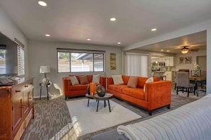 Stylish, comfy family room with 55” tv. 