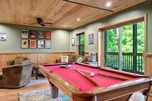 Game room with pool table, lounge area and arcade games!