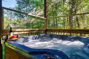 Relax in the hot tub surrounded by nature.