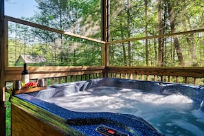 Relax in the hot tub surrounded by nature.