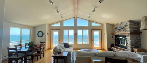 Comfy Living Room with oceanfront views and a gas fireplace.