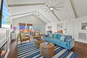 Welcome to the living room with pops of color throughout!