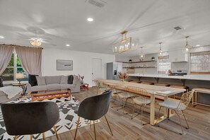 The dining room table is big enough for 10 people to enjoy time together. 