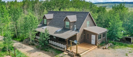 Heart of the Aspens home is nestled in an aspen grove, with acres of land surrounding the house.