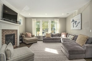 Indulge in Late Nights Around the Crackling Fire of the Living Room Fireplace