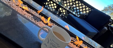 Enjoy a nice cup of coffee over an open fire on the porch