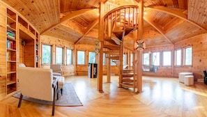 Spectacular wooden spiral staircase in the three story "tower"