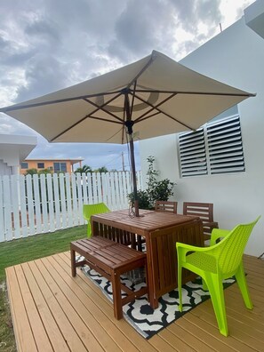 Outdoor deck with dining area and BBQ