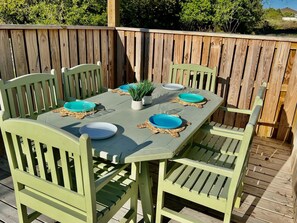 Plastic plates and cups provided for your pool side dining under the pergola