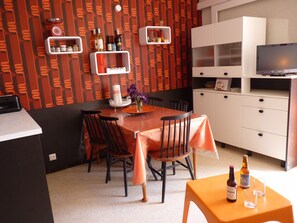 Living room with dining area seventies atmosphere
