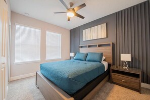 Another of our rooms adorned with delightful decor and a queen sized bed for every family member comfort! —a magical space designed to turn vacation time into an enchanting experience for your loved ones. 