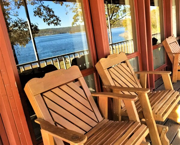 Watch the boats on the lake, relaxing in glider rockers.