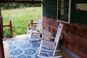 Enjoy relaxing on the large front porch with comfortable rocking chairs.