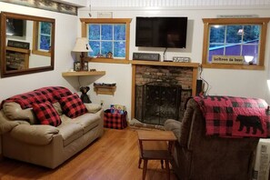 Cozy, rustic interior is comfortable for a couple or small family.