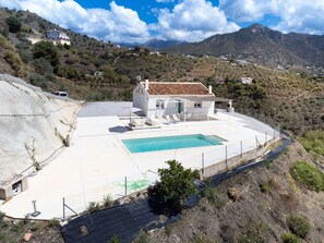 Sky, Cloud, Plant, Property, Mountain, Building, Swimming Pool, Slope, Landscape, Composite Material