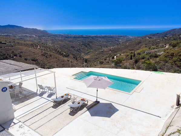 Sky, Building, Azure, Mountain, Shade, Outdoor Furniture, House, Urban Design, Slope, Swimming Pool