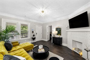 Chic Livingroom with Smart TV and Romantic Faux Fireplace