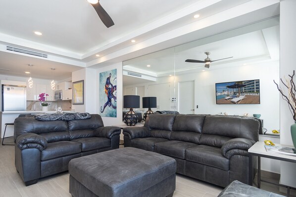 Comfortable leather sofas adorn the living room area