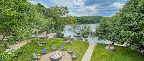 Lakeside with firepit & view of cottage