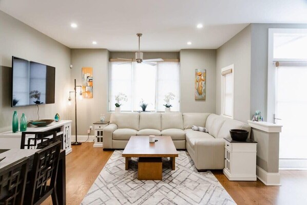 Spacious Living Room with Smart TV and Electric Fireplace