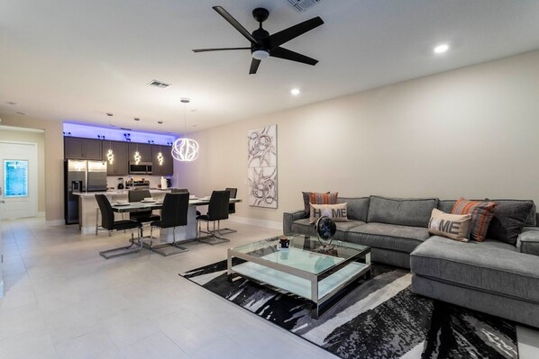 Open living space that seamlessly connects the beautiful kitchen and dining area, offering a perfect blend of comfort and style.