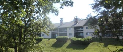 view of condos from pool area