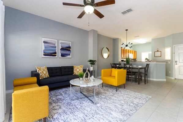 Open living space that seamlessly connects the beautiful kitchen and dining area, offering a perfect blend of comfort and style.