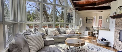 Living room with tons of natural light.  Includes Smart TV & Fireplace.