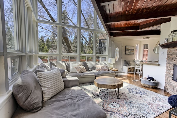 Living room with tons of natural light.  Includes Smart TV & Fireplace.