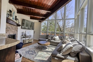 Living room with tons of natural light.  Includes Smart TV & Fireplace.