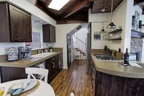 Full kitchen with stainless steel appliances