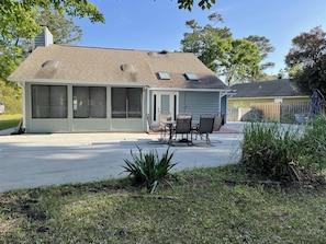 Back patio with table and chairs.