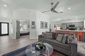 Modern open-concept living with easy flow between the living room and kitchen.