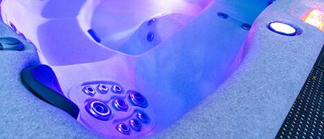 Slip into the alluring hot tub with 40 spa jets, contoured seating & Colorscape® lighting...