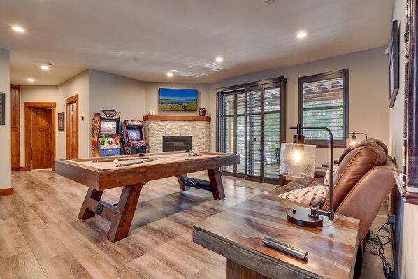Recreation area with pool table, arcades, seating, and flat screen tv