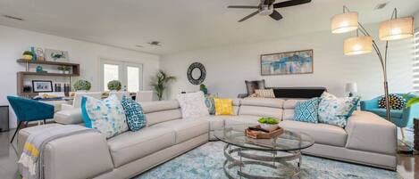 [Living Room] Open floor plan with lots of seating areas to view the 65" smart TV.